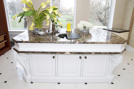 part of the kitchen a large marble table