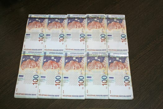 10 stacks of Malaysia RM100 Notes.