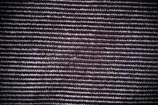 Dark gray corduroy texture with vignetting on the corners