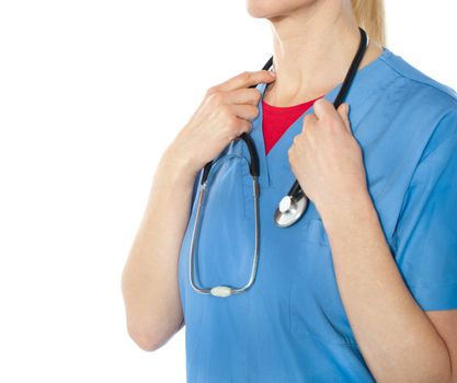 Female professional doctore holding stethoscope with her hands, closeup shot