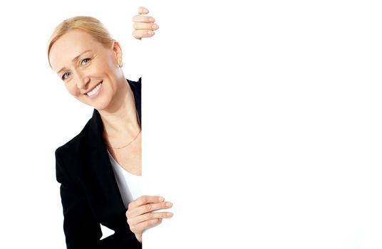 Businesswoman holding clipbaord isolated over white