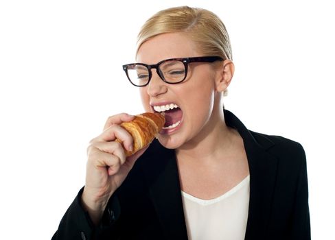 Beautiful businesswoman eating isolated over white