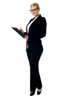 Businesswoman with a clipboard, side view