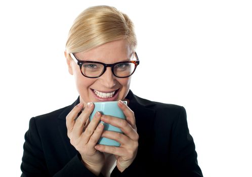 Corporate woman enjoying coffee, closeup shot