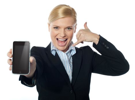 Woman holding phone showing call me gesture.