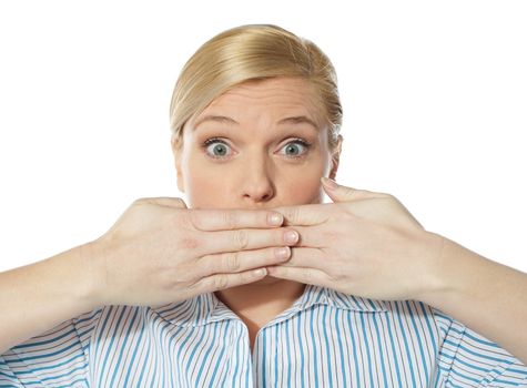 Surprised Young female posing with hands on her mouth