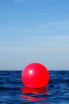 close-up of a red bouy in the ocean