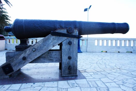 close up of an old cannon in italy