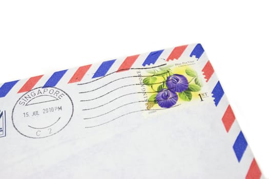 Corner of an airmail envelop with Singapore Postage.