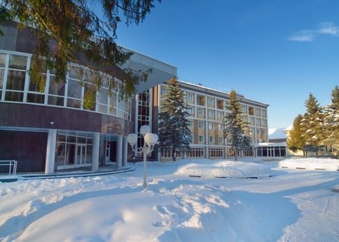 Hotel building with clear blue sky on sunny winter day