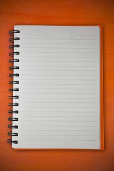 notebook on wood pattern