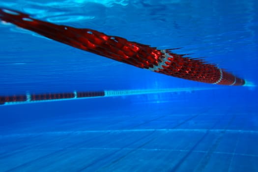 underwater view from a swimming pool with red marking