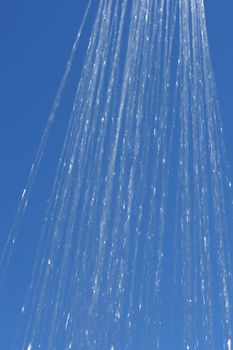 water drops falling from a shower outside