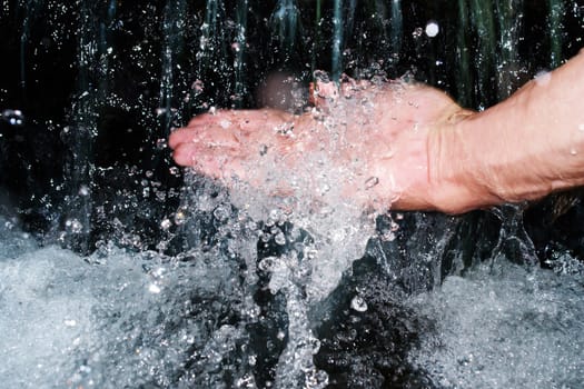 Close-up of a person washing his hand