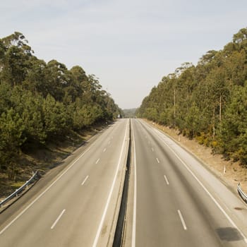 A highway roda with trees around