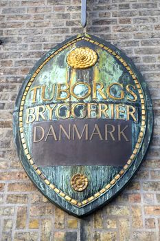 Sign on a facade of the main office of brewery Tuborg in Copenhagen Denmark