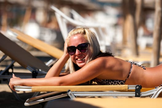 Young blond woman at the ocean