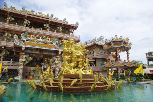 Goddess Naja beating the dragon and china temple Chonburi Thailand on 17 November 2011