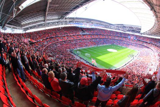 LONDON - APRIL 14 : Supporters watch the football game of Liverpool - Everton Semi Final FA Cup Crowd at Wembley Arena Staduim on April 14, 2012 in London, England United Kingdom.