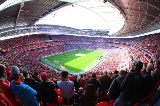 LONDON - APRIL 14 : Supporters watch the football game of Liverpool - Everton Semi Final FA Cup Crowd at Wembley Arena Staduim on April 14, 2012 in London, England United Kingdom.