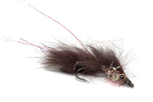 brown streamer hook to fish flat on white background