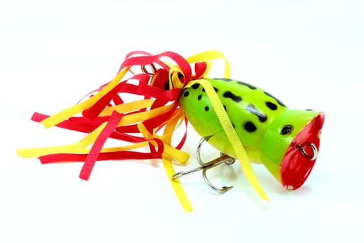 frog popper imitation for fishing on horizontal surface on a white background