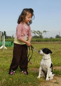 little girl and her purebred jack russel terrier