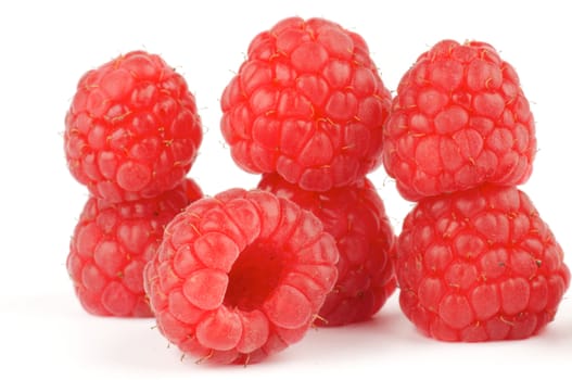 Arrangement of Fresh Ripe Perfect Raspberry isolated on white background