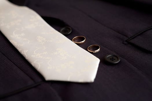 tie and wedding rings