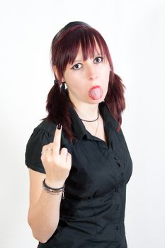 young readhead woman showing middle finger and tongue - isolated on white background