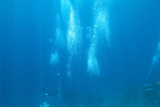 background of bubbles of divers in deep water