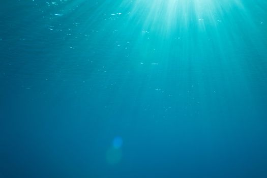 a background with sunbeams underwater