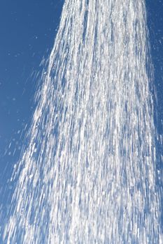 water drops falling from a shower outside