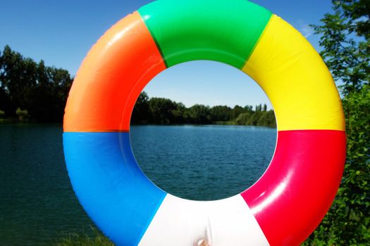 swim ring floating on beautiful blue lake