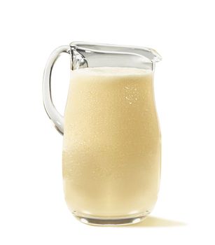Jar of milk isolated on white background