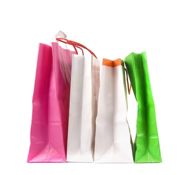 Assorted colored shopping bags on a white background