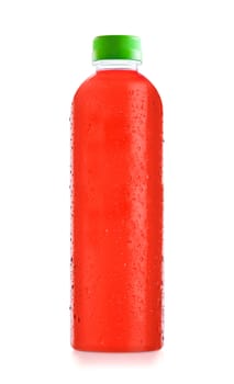 bottled fruit juice with drops of water isolated