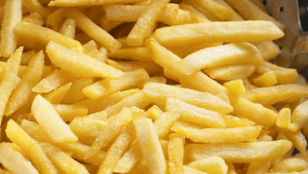 fried potatoes closeup background or texture