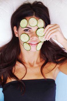 cucumbers circles on a girl face