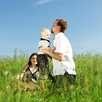 happy family in green grass