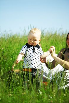  happy family on picnic in green grass