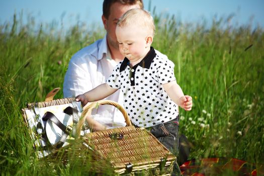  happy family on picnic in green grass