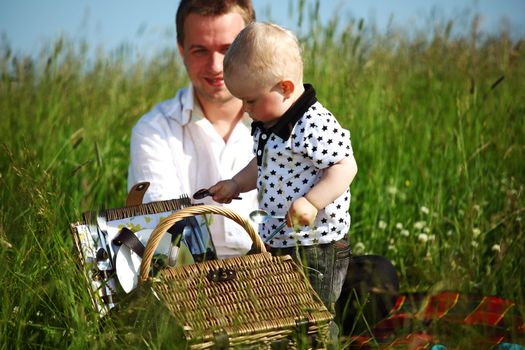  happy family on picnic in green grass