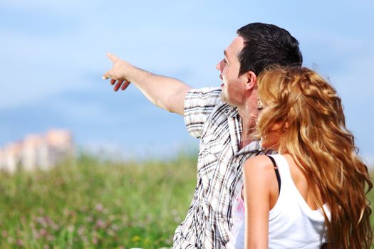man and woman see houses and new flat