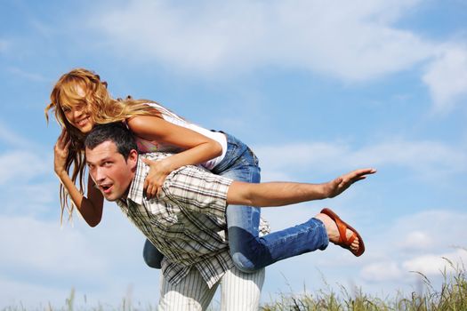 man and woman hug in the sky