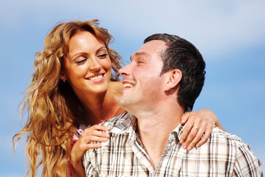 man and woman hug in the sky