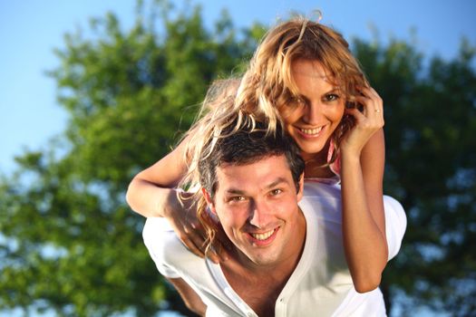 man and woman hug in the sky