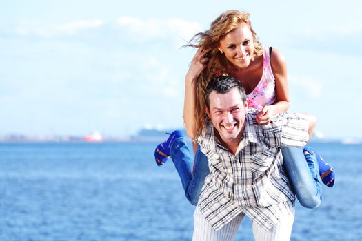 man and woman hug in the sky and sea on sea