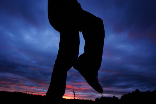 Person infront of nice clouds in the sky during the sundown