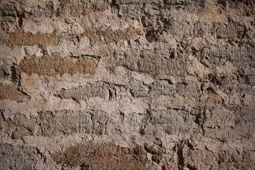 Weathered and stained brickwork from an old church wall.